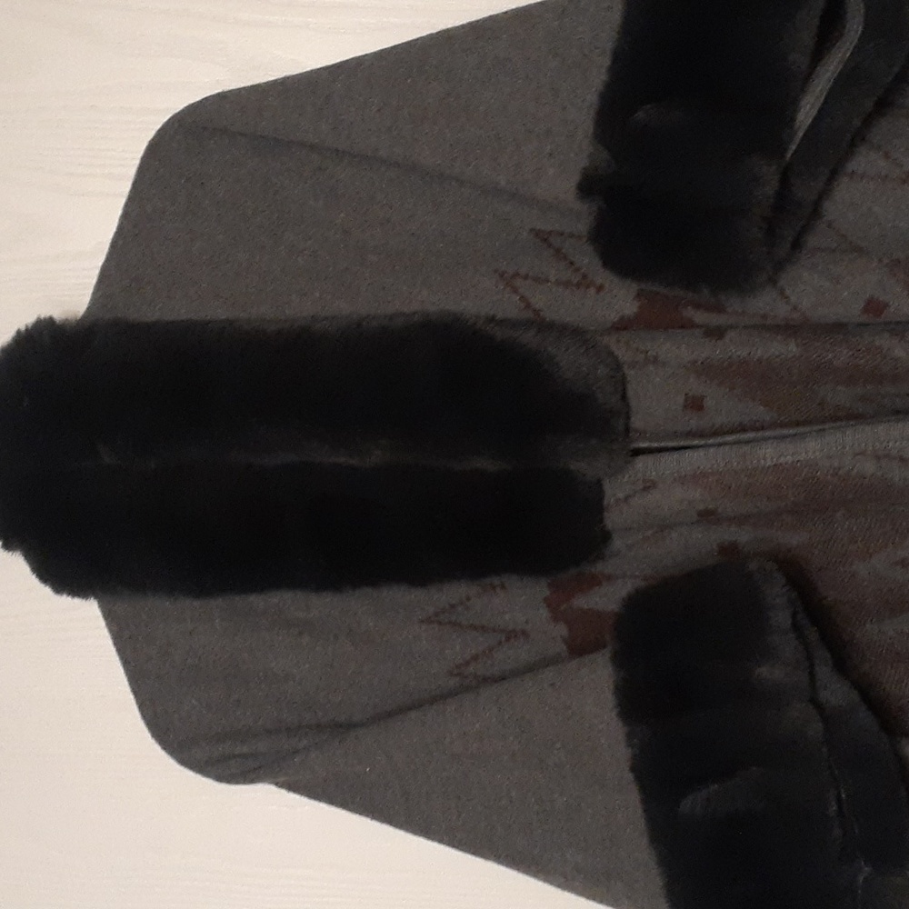 beautiful shawl with faux fur. have had in my closet forever and never worn.
